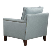 Uttermost Charlotta Accent Chair in Sea Mist fabric with plush cushioning and wooden legs, stylish arm chair for living spaces.