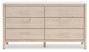 Signature Design by Ashley Cadmori six-drawer dresser with dark wood finish and sleek metal handles, detailed view of dresser drawers.