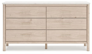 Signature Design by Ashley Cadmori six-drawer dresser with dark wood finish and sleek metal handles, detailed view of dresser drawers.