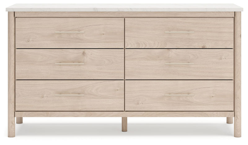 Signature Design by Ashley Cadmori six-drawer dresser with dark wood finish and sleek metal handles, detailed view of dresser drawers.