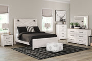 Gerridan 6-piece bedroom set with matching panel bed, dresser, mirror, nightstands, and wall sconces from Signature Design by Ashley.