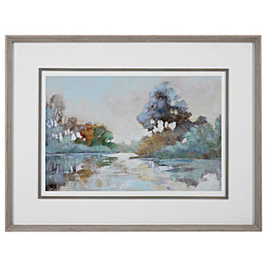 Watercolor framed print titled Morning Lake by Uttermost featuring a serene blue lake scene with a wooden frame.