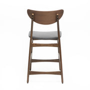 Elegant Noble House counter height chair with cushioned seat and wooden legs, perfect for kitchen or bar seating.