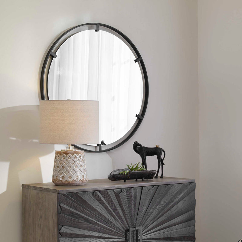 Round black iron accent mirror by Uttermost featuring a sleek, minimalist design perfect for modern interior decor.