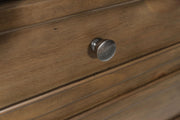 Medium brown Feddinger two-drawer nightstand by Signature Design Ashley, featuring a sleek accent nightstand with modern drawer handles.