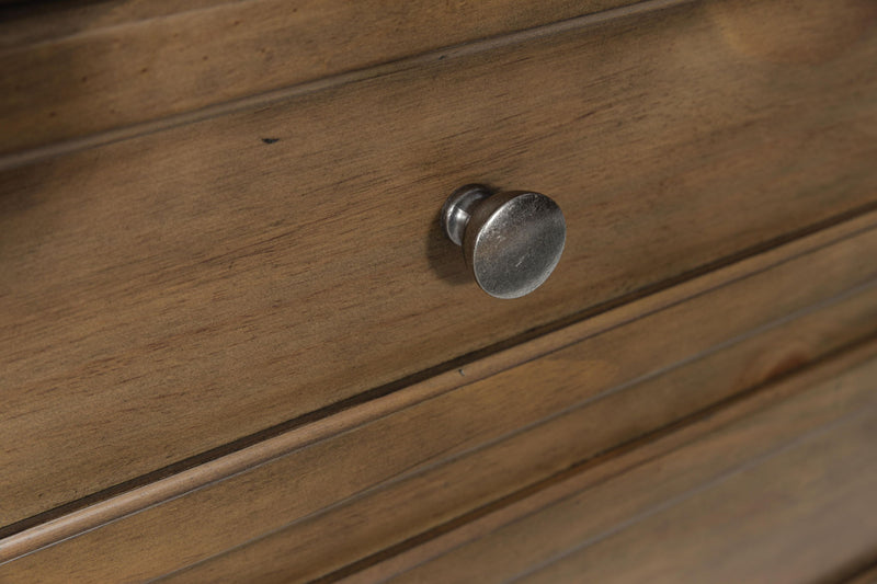 Medium brown Feddinger two-drawer nightstand by Signature Design Ashley, featuring a sleek accent nightstand with modern drawer handles.