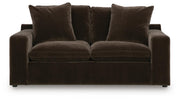 Benchcraft® Maxton Heights stationary loveseat with plush upholstery and modern design, shown in a cozy living room setting.