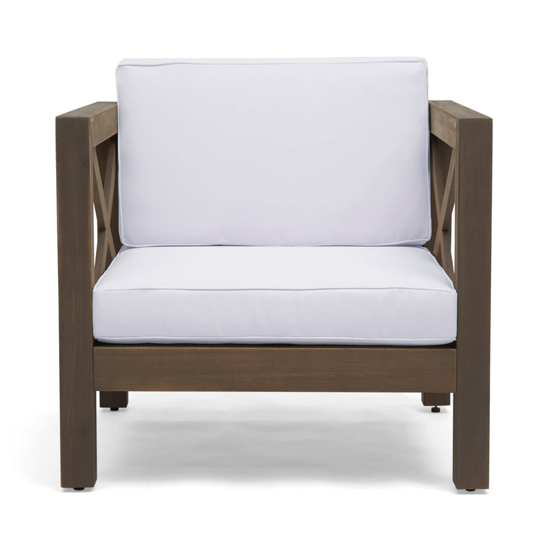 Noble House Brava mid-century modern arm chair with water-resistant cushions, featuring sleek wooden legs and plush seating.