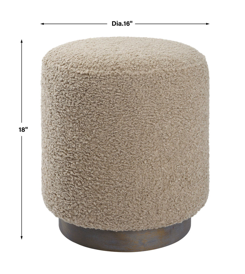 Uttermost Avila accent ottoman with upholstered fabric and wooden legs, versatile piece for living room or bedroom decor.