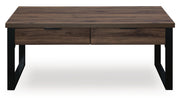 Signature Design by Ashley Wickman Falls rectangular cocktail table with a sleek wooden surface and modern design.