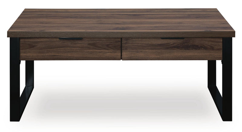 Signature Design by Ashley Wickman Falls rectangular cocktail table with a sleek wooden surface and modern design.