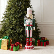 Noble House Christmas nutcracker decor in green, red, and white with durable construction, perfect for holiday holiday decorating.