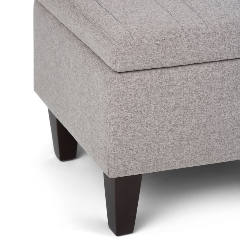 Simpli-Home Monroe upholstered storage ottoman with cushioned top and fabric exterior, ideal for living room storage.
