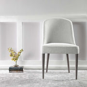 Set of two Uttermost Brie armless chairs with sleek modern design and neutral upholstery, perfect for contemporary living spaces.