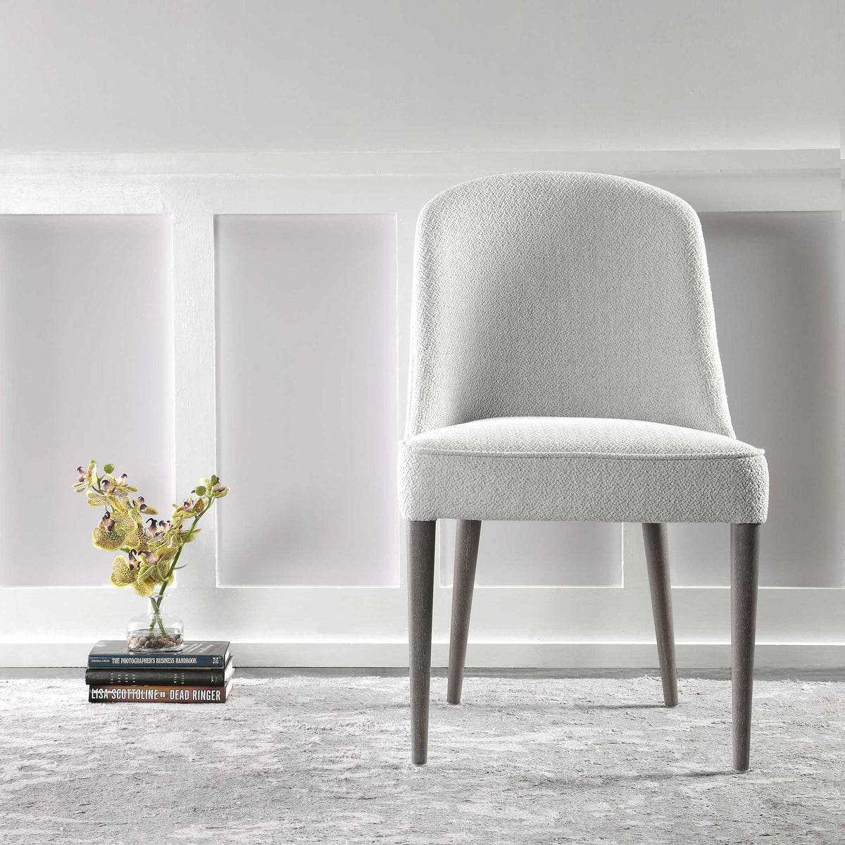 Set of two Uttermost Brie armless chairs with sleek modern design and neutral upholstery, perfect for contemporary living spaces.