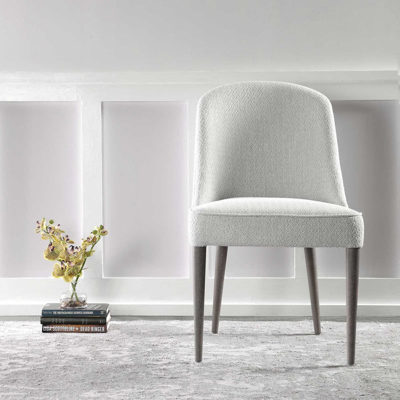 Set of two Uttermost Brie armless chairs with sleek modern design and neutral upholstery, perfect for contemporary living spaces.