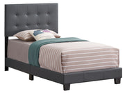 Glory Furniture Caldwell upholstered bed with plush fabric and a modern design, shown in a stylish bedroom setting.