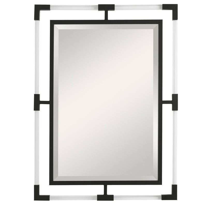 Uttermost Balkan iron wall mirror with round frame, decorative metal design, hanging on a neutral wall interior.