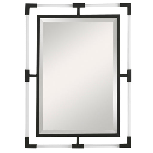 Uttermost Balkan iron wall mirror with round frame, decorative metal design, hanging on a neutral wall interior.
