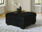 SimpleJoy oversized accent ottoman by Signature Design by Ashley®, featuring plush fabric and a spacious seating surface.