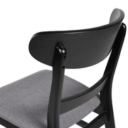 Noble House modern dining side chair with upholstered seat and wooden frame, showcasing sleek design and comfortable seating.