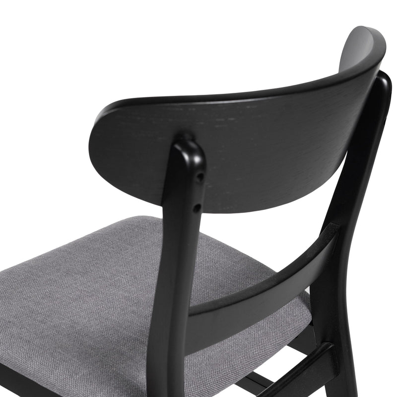 Noble House modern dining side chair with upholstered seat and wooden frame, showcasing sleek design and comfortable seating.