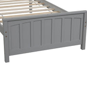 DreamHaus platform trundle bed with wooden frame and clean design, featuring a hidden pull-out drawer for extra sleeping space.