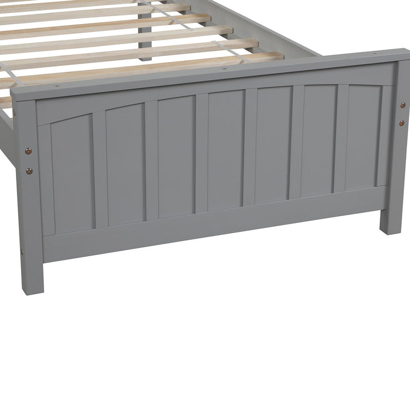 DreamHaus platform trundle bed with wooden frame and clean design, featuring a hidden pull-out drawer for extra sleeping space.