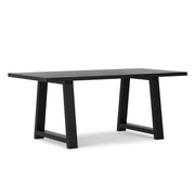 Simpli-Home Whitley dining table with wooden surface and sturdy legs, ideal for modern dining rooms.