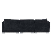 Modern Luxe & Co. L-shaped sectional sofa with oversized chaise, four seats, and two plush pillows in a stylish living room setting.