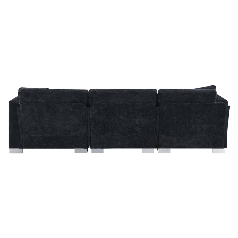 Modern Luxe & Co. L-shaped sectional sofa with oversized chaise, four seats, and two plush pillows in a stylish living room setting.