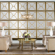 Set of two gold square wall mirrors by Uttermost, featuring sleek modern design and reflective glass surfaces.