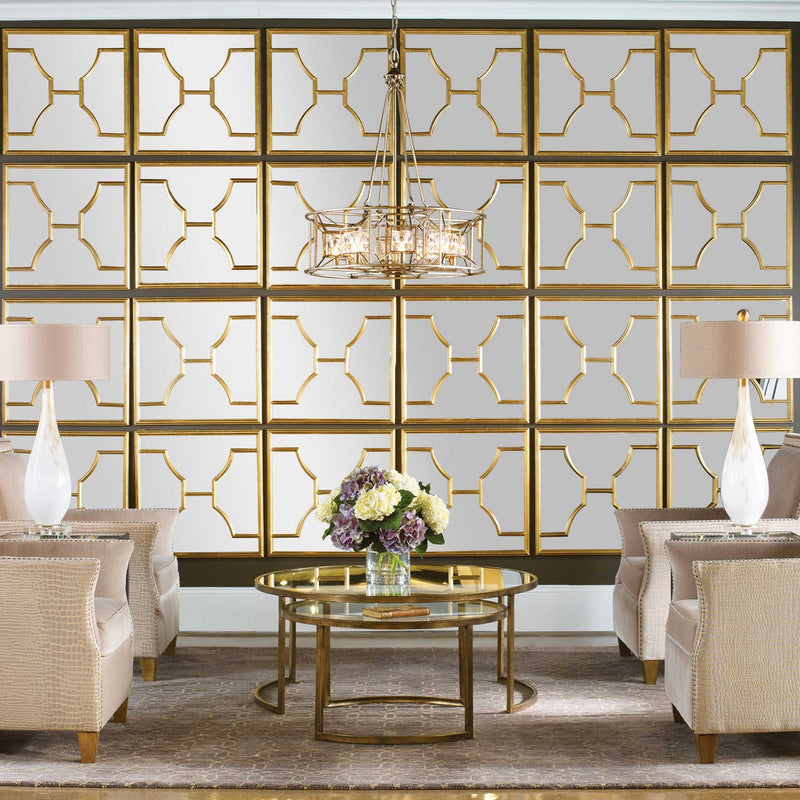 Set of two gold square wall mirrors by Uttermost, featuring sleek modern design and reflective glass surfaces.