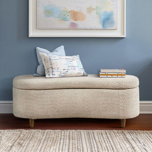 JLA Bailey flip top storage bench in taupe with cushioned seat and wooden legs, offering stylish storage solution.
