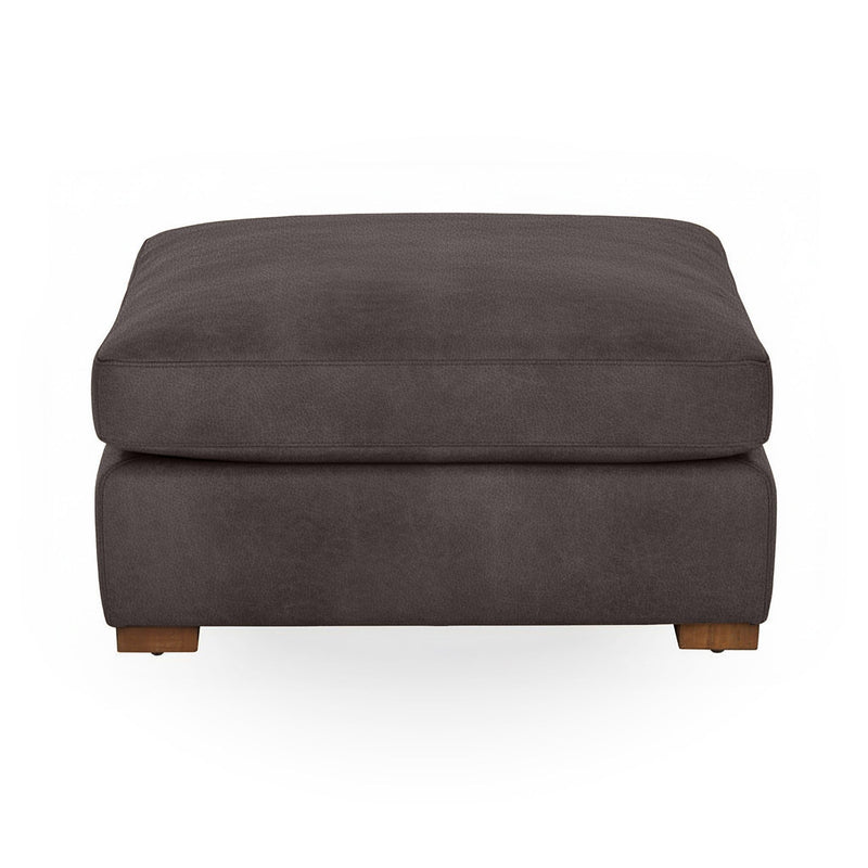Classic Home Audrey upholstered ottoman with a cushioned top and wooden legs, ideal for living room or bedroom decor.