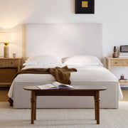 House & Home Furniture Lucas tall upholstered headboard bed with padded fabric and sleek design, shown in a modern bedroom setting.