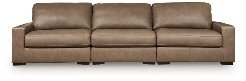 Benchcraft Veronella stationary sectional sofa with plush cushions and modern design, shown in a cozy living room setting.