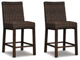 Set of two Signature Design by Ashley Paradise Trail barstools in medium brown wood with cushioned seats, modern and stylish for dining.