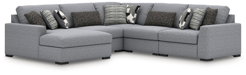 Benchcraft Bealton stationary sectional sofa with plush cushions and fabric upholstery, displayed in a modern living room setting.