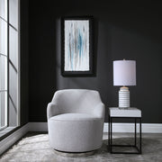 Gray Hobart casual swivel chair by Uttermost featuring a modern design with a rounded back and cushioned seat.