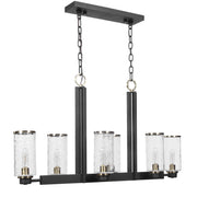 Uttermost Jarsdel 6-light industrial island pendant light in black with metal shades hanging from a ceiling mount.