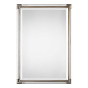 Silver metallic wall mirror by Uttermost with a sleek, round design and reflective mirror surface.