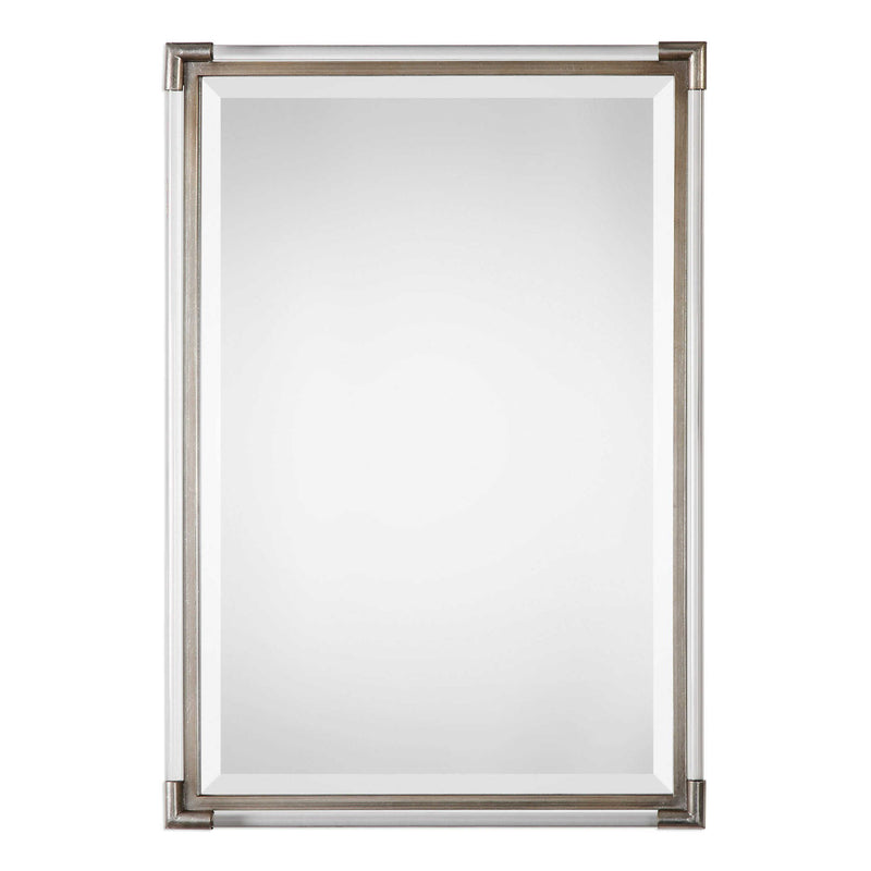 Silver metallic wall mirror by Uttermost with a sleek, round design and reflective mirror surface.