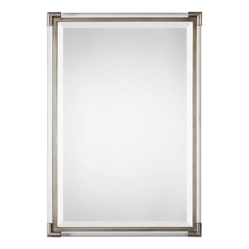 Silver metallic wall mirror by Uttermost with a sleek, round design and reflective mirror surface.