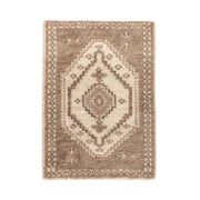 Hand-knotted Luxor Area Rug by Classic Home featuring intricate patterns and warm colors, perfect for enhancing living spaces.