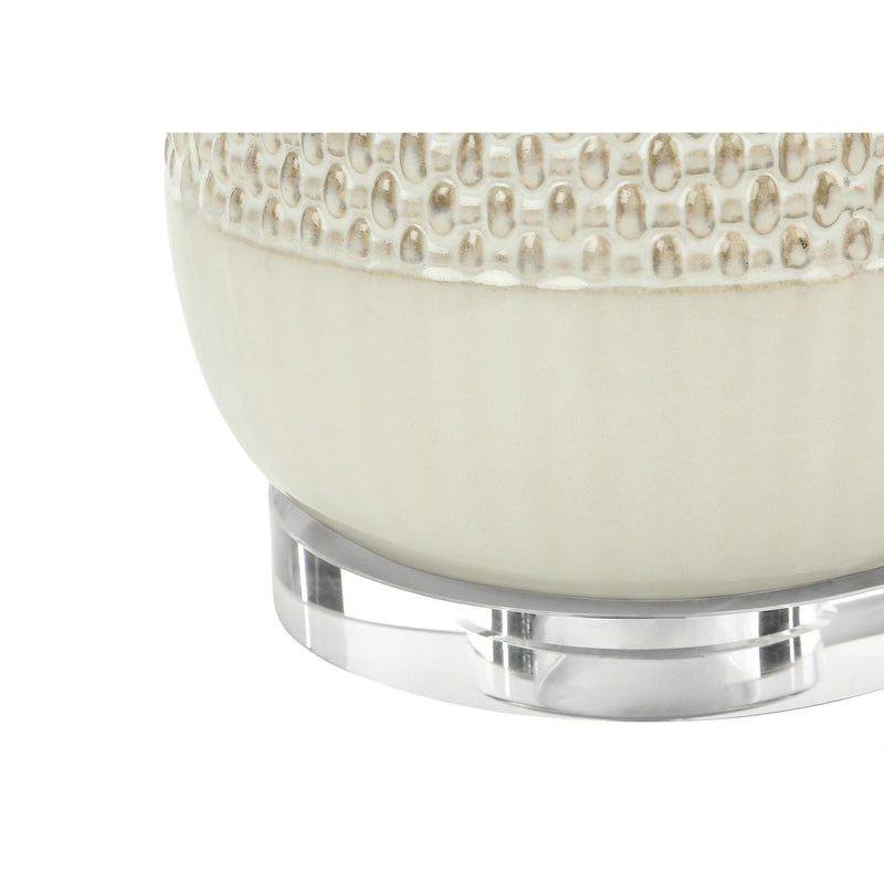 Cream ceramic and resin contemporary 8th Street table lamp with a sleek, modern design and soft lighting.