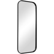 Uttermost Concord tall black iron wall mirror with sleek frame, hanging on a neutral-colored wall, showcasing modern mirror design.