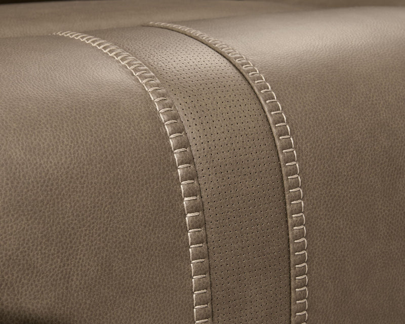 Signature Design by Ashley reclining sectional with plush cushions and chaise lounge, perfect for modern living rooms.