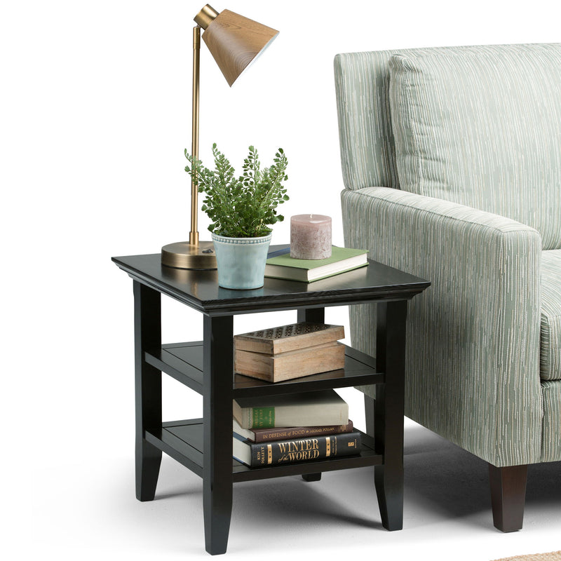 Handcrafted Acadian end table by Simpli-Home with wooden finish, featuring a sturdy top and storage shelf for living room decor.