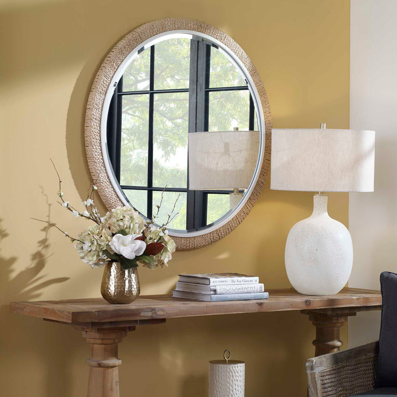 Round rope wall mirror with light brown frame by Uttermost, showcasing a stylish design perfect for modern decor.